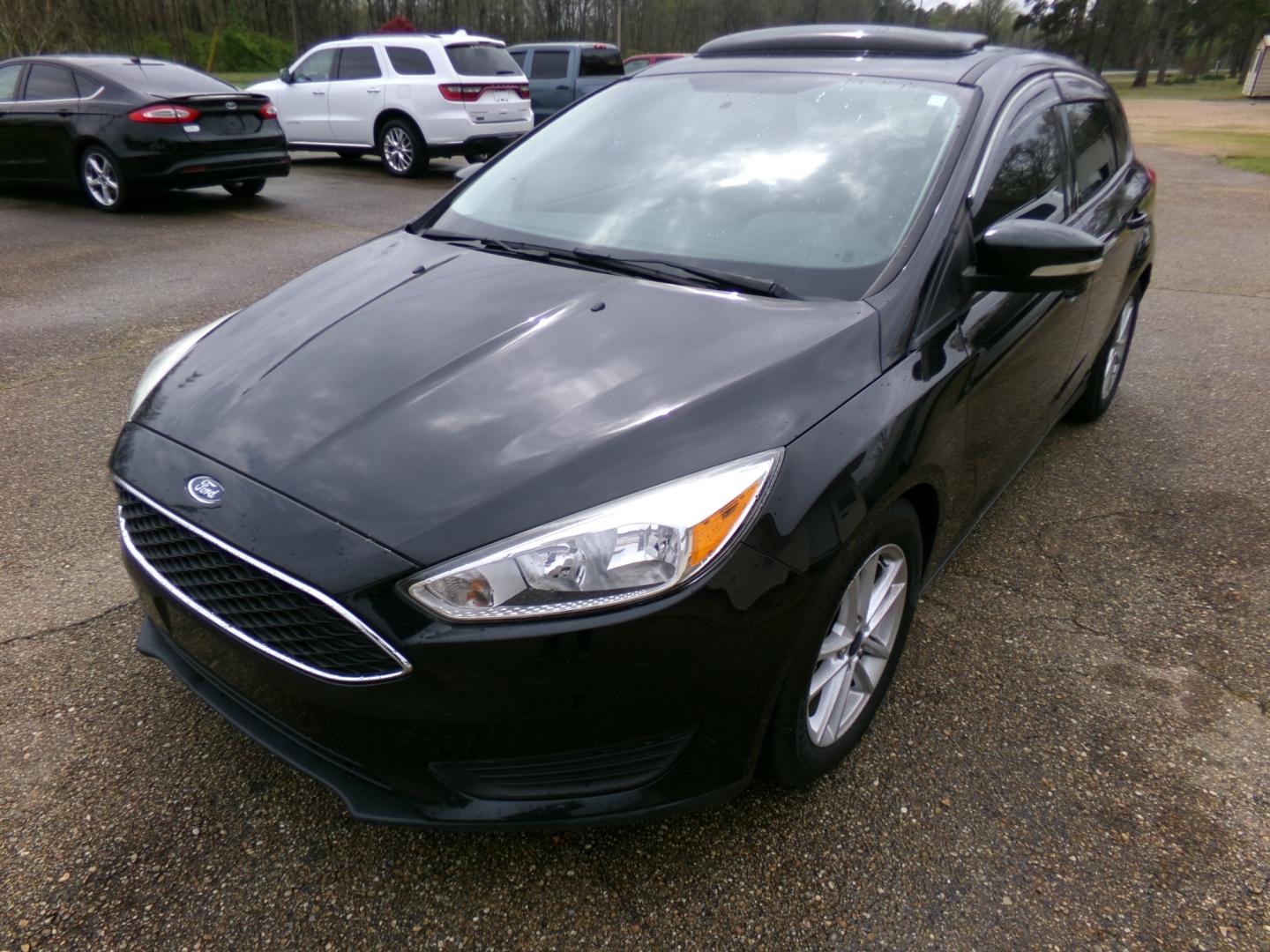 2015 Black /Black Ford Focus SE (1FADP3K27FL) , automatic transmission, located at 401 First NE, Bearden, AR, 71720, (870) 687-3414, 33.726528, -92.611519 - Photo#0